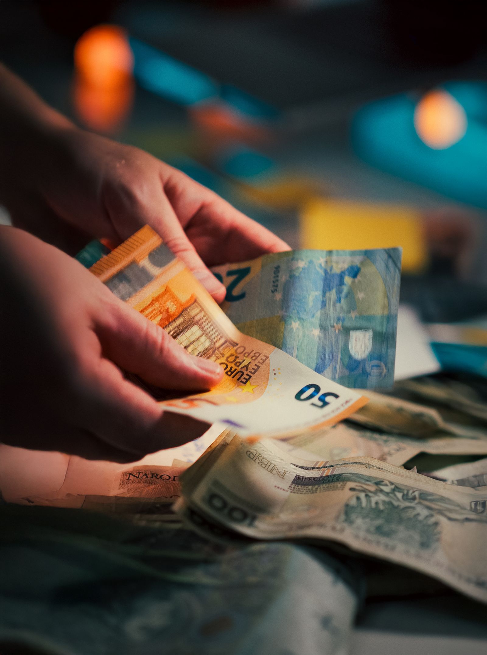 Hands counting euro banknotes — transfers and currency exchange before moving to Morocco